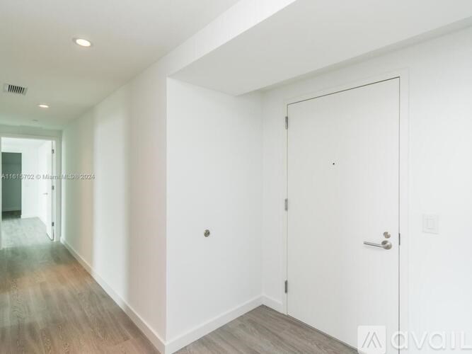 A white door is on the right side of the image.