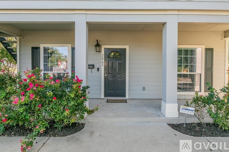 A house with a front yard and a sign that says "available".