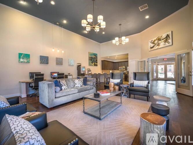 A living room with a grey couch and a coffee table.