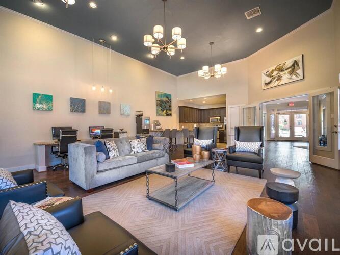 A living room with a grey couch and a coffee table.