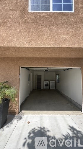 A garage with a sign that says "available" on the floor.
