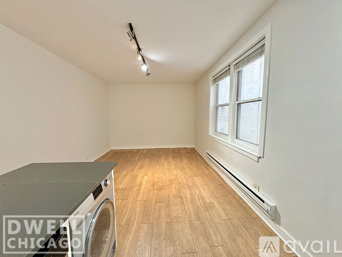 A room with a table and a window.
