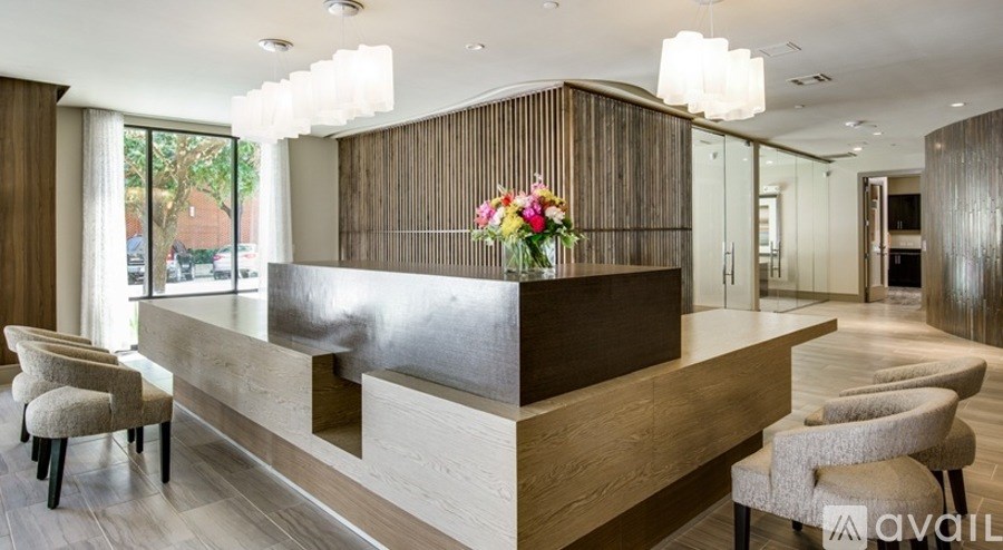 A reception area with a long counter and chairs.