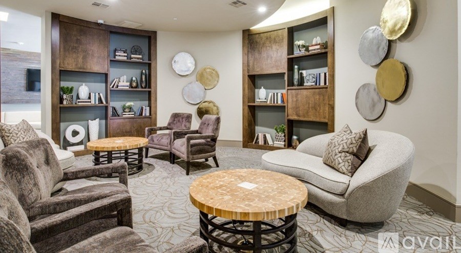 A living room with a variety of seating options and a wooden coffee table.