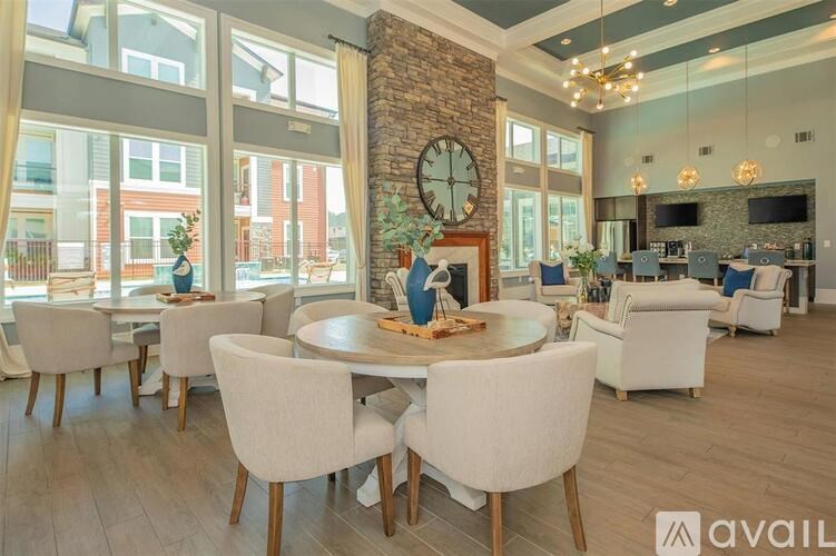 A modern dining room with a large table and chairs.