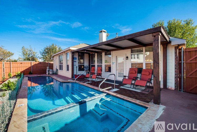 A house with a pool in the backyard.