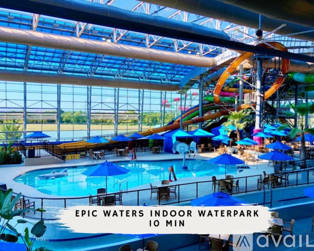 A waterpark with a slide and a pool.