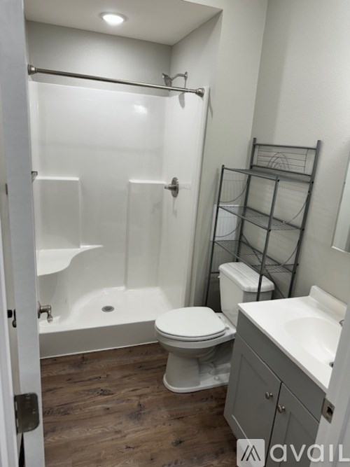 A bathroom with a toilet, sink, and bathtub.