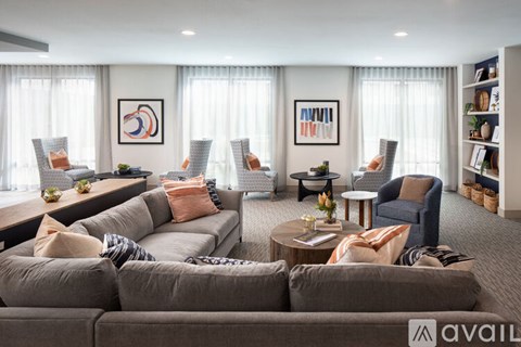 A living room with grey couches and a coffee table.