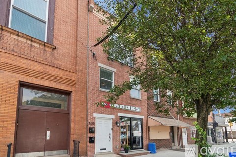 A brick building with a storefront that says "49 Books".