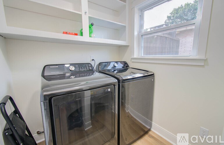 Two microwaves are sitting on a counter.