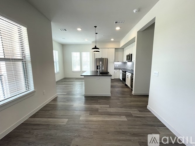 A spacious kitchen with a large island in the middle.