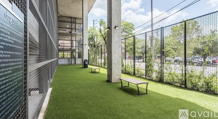 A dog park with a sign that says "dog park" on the left side.