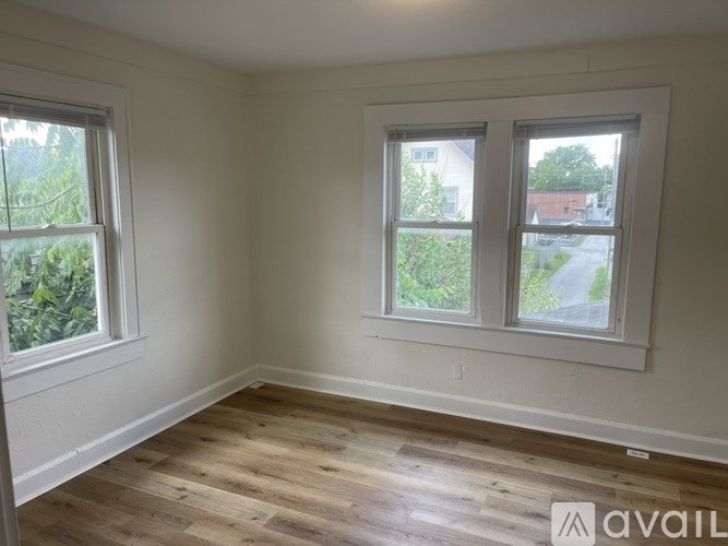 A house with a yard in front of it.