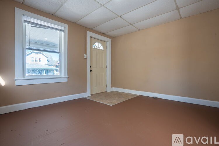 A room with a door and a window.