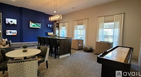 A living room with a piano and a television.