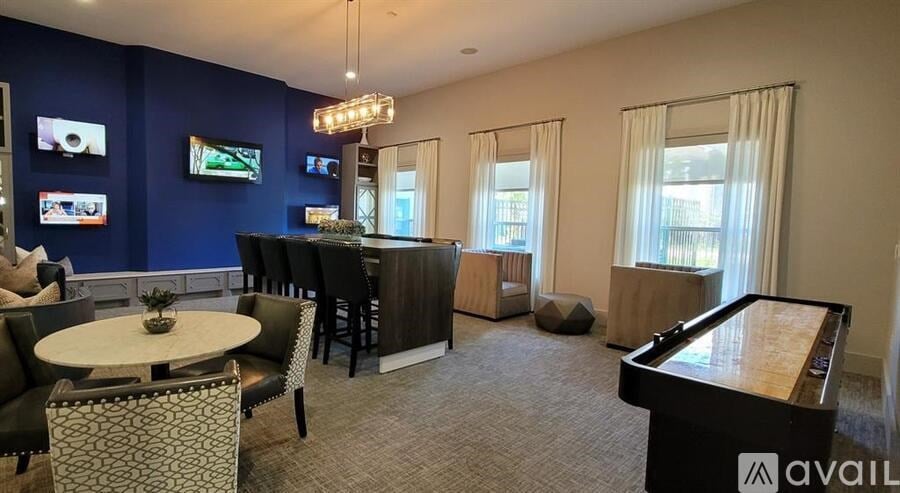A living room with a piano and a television.
