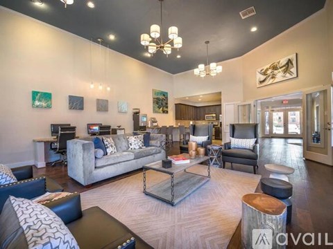 A living room with a grey couch and a coffee table.