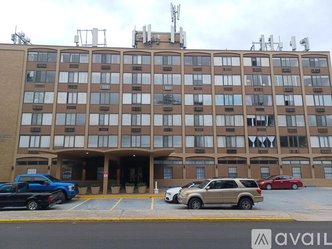 A large building with a parking lot in front of it.