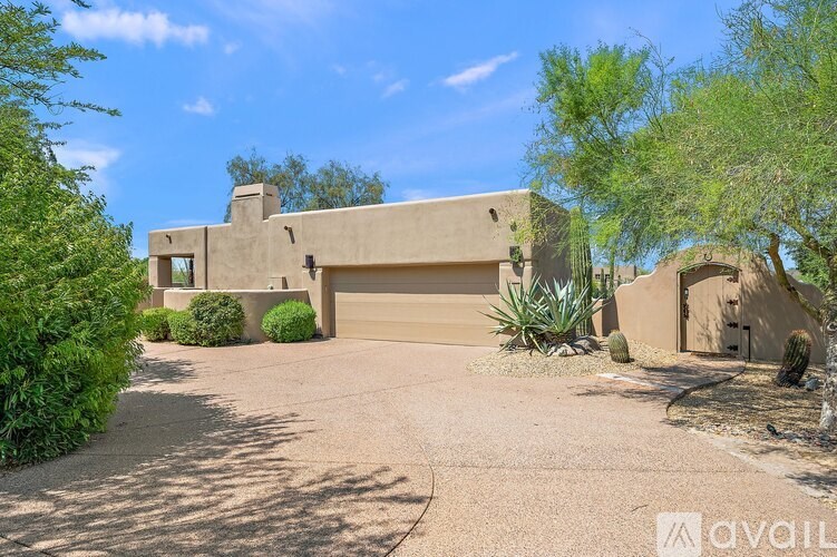 A house with a driveway and a garage door.