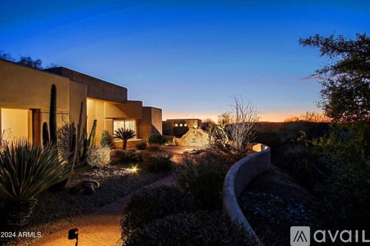 A modern house with a garden in front is available for rent.