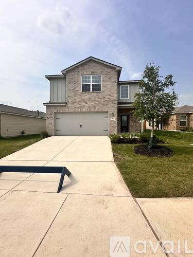 A house with a driveway in front of it.