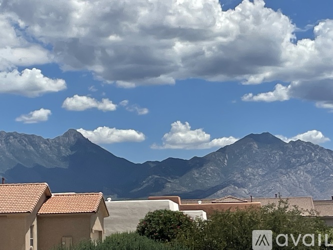 A mountain range is in the background of a suburban area.