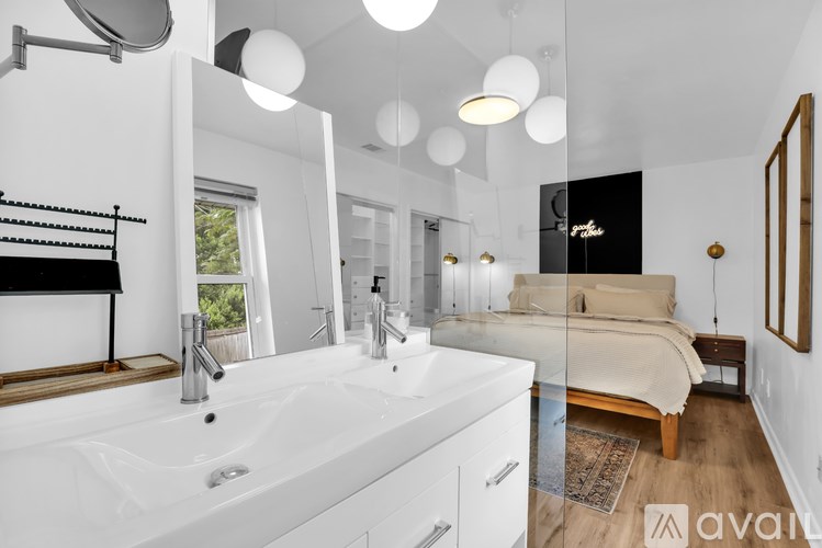 A bathroom with a large sink and a mirror.