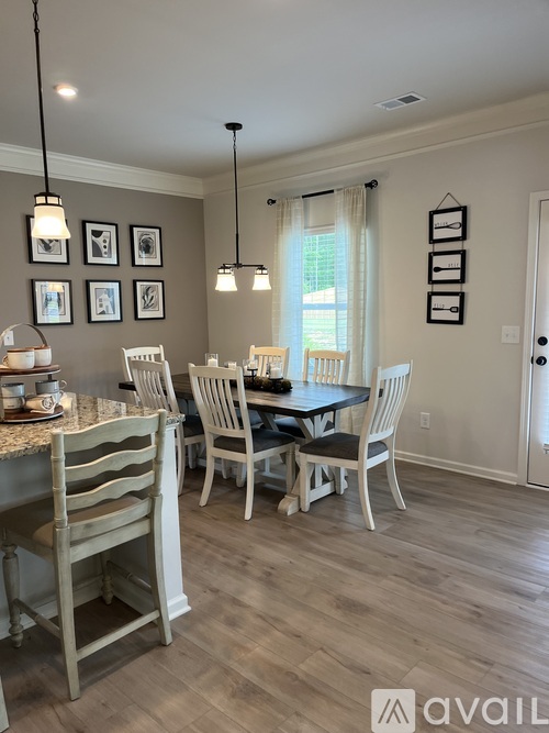 A dining room with a table set for four.