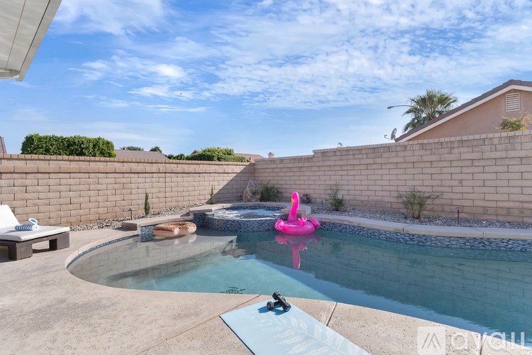 A pool with a pink float in it.