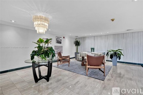 A living room with a glass table and chairs.