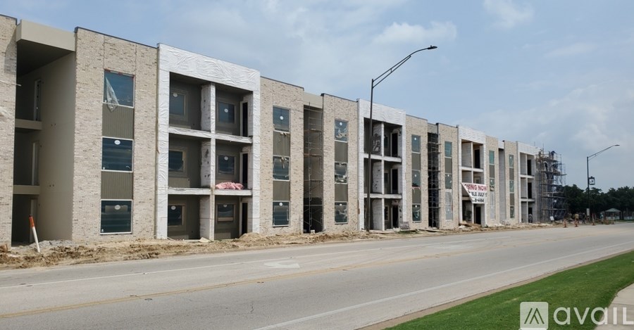 A row of new apartment buildings are under construction.