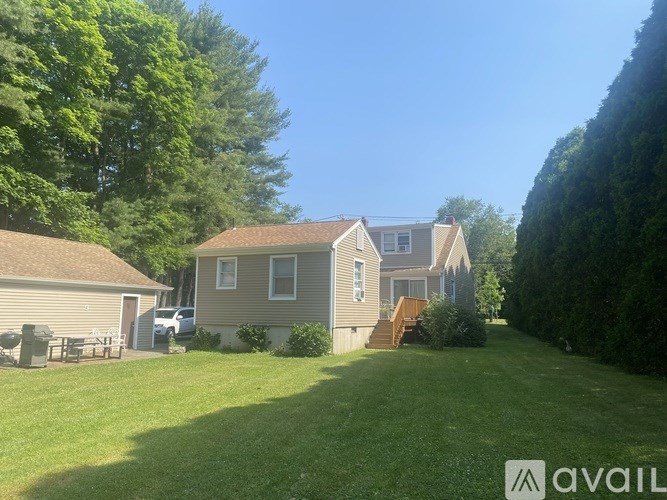 A house with a lawn in front of it.