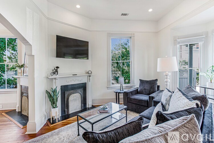 A living room with a fireplace and a couch.