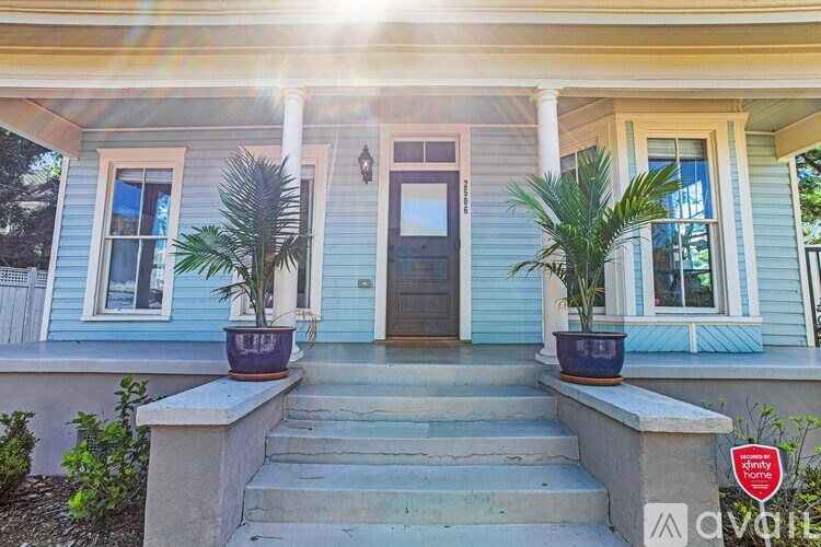 A house with a blue front and a black door.