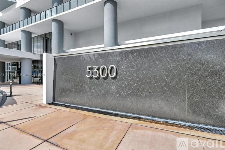 A building with the number 5300 on a wall.