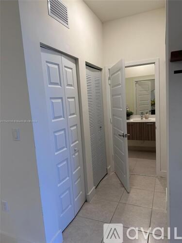 A white bathroom with a toilet and sink.