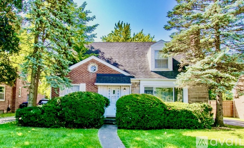 A house with a white door and a small window above it.