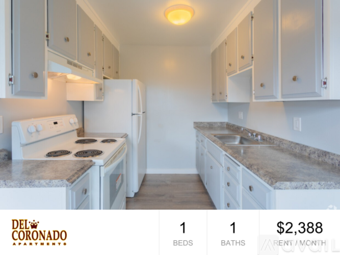 A kitchen with a refrigerator, stove, and countertops is on the market for rent at $2,388 per month.