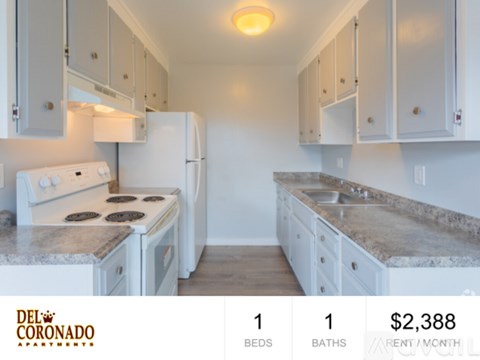 A kitchen with a refrigerator, stove, and countertops is on the market for rent at $2,388 per month.