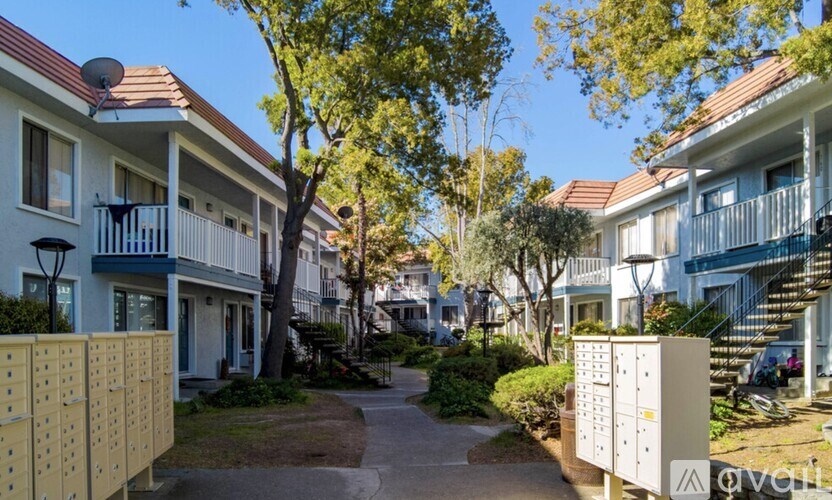 A row of houses with a mailbox in front.