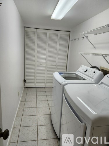 A laundry room with a washer and dryer.