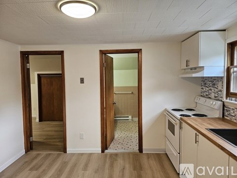 A kitchen with a stove top oven and a counter top.