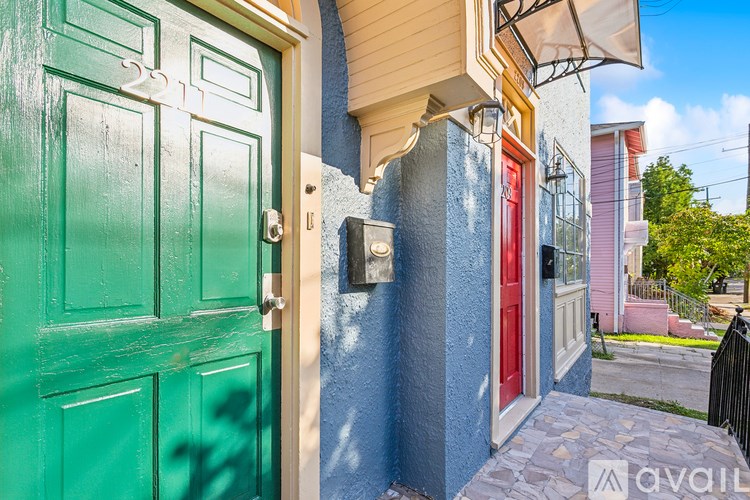 A green door is on the left and a red door is on the right.