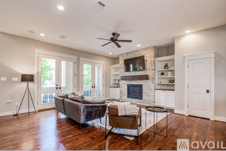 A living room with a fireplace and a couch.