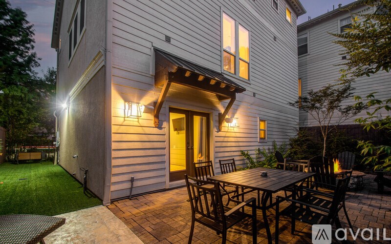 A house with a patio and a table set for dining.