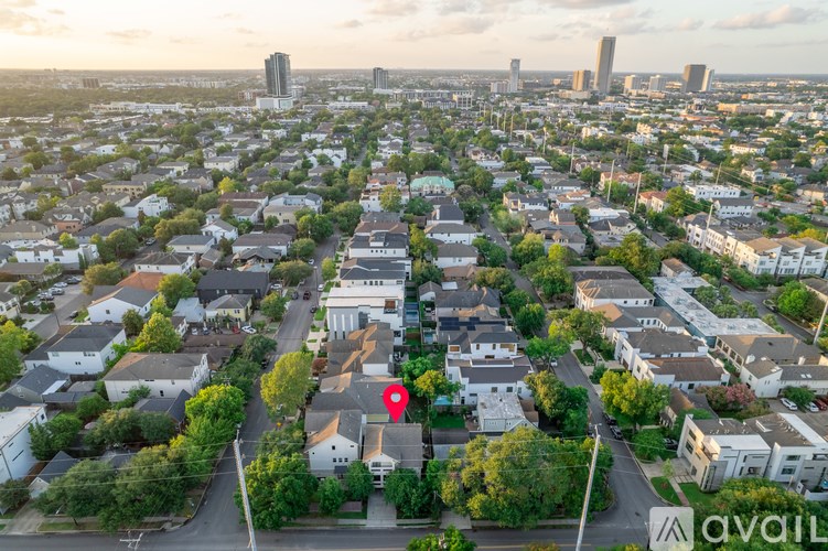 A bird's eye view of a residential area with a red marker indicating a specific location.