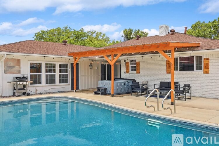 A pool with a pergola and chairs is available for rent.