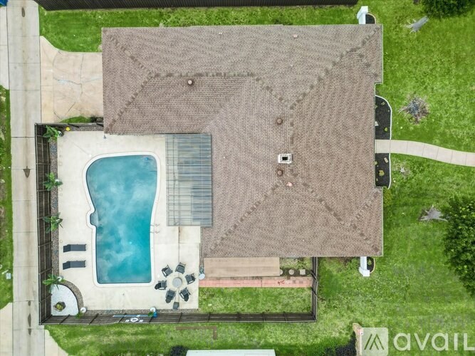 A house with a pool in the backyard.