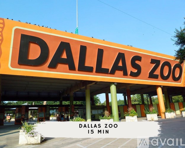 The entrance to the Dallas Zoo is shown with a sign indicating it is a 15 minute walk.